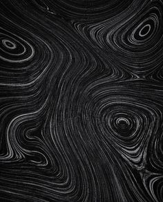 an abstract black and white background with swirls