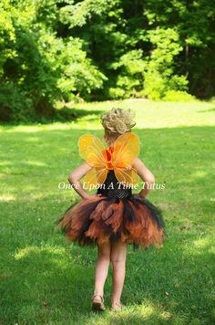 Orange and Black Tutu Dress This gorgeous orange & black tutu on an unlined black top is so versatile! Wear with a butterfly Halloween costume, use a autumn photo prop, first birthday party outfit, or just for play! Sizes and Lengths: 0-6 Months 6 Inch Length 6-12 Months 7 Inch Length 12M-2T 8 Inch Length 3T - 4T 11 Inch Length 5 - 6 12 Inch Length 7 - 8 14 Inch Length 10-12 15 Inch Length Tutu will be shipped safely in a box to prevent crushing. Perfect for gift giving, dress up, photo prop Fitted Black Costume For Dress-up, Black Halloween Costumes For Dress-up, Fitted Halloween Tutu Dress Costume, Fitted Tutu Dress For Halloween Dress-up, Black Tulle Tutu Dress For Costume Party, First Birthday Party Outfit, Black Tutu Dress, Butterfly Halloween Costume, Pixie Costume