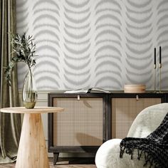 a living room scene with focus on the table and wallpapered walls behind it