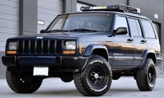 a jeep parked in front of a building