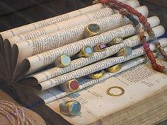 a stack of rolled up newspapers sitting on top of a table