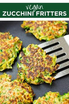 zucchini fritters on a pan with a fork