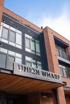 a building with a sign that says union wharf on the front and side of it