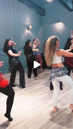 a group of women dancing in a dance studio