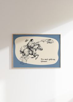 a drawing of a man on a horse is hanging on the wall above a bed