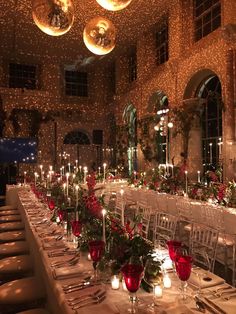 a long table is set up with candles and centerpieces for an elegant event