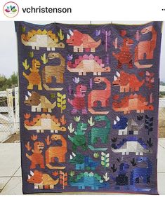 an image of a quilt made to look like dinosaurs