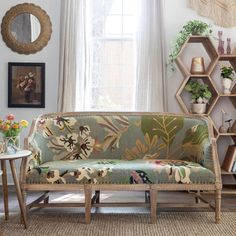 a living room scene with focus on the couch and coffee table in the foreground