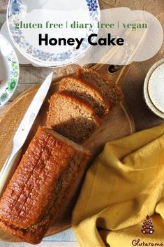 a loaf of honey cake sitting on top of a wooden cutting board