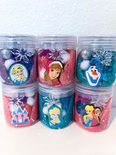 six plastic containers filled with princess themed items