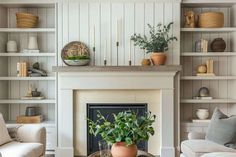 a living room filled with furniture and a fire place in front of a white fireplace