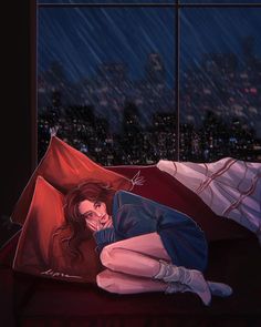 a woman laying on top of a red couch under an umbrella in the rain at night