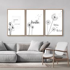 two black and white posters with dandelions in the middle are hanging above a couch