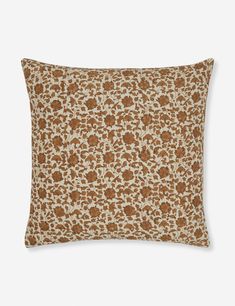 a brown and white pillow with an animal print pattern on it's front side