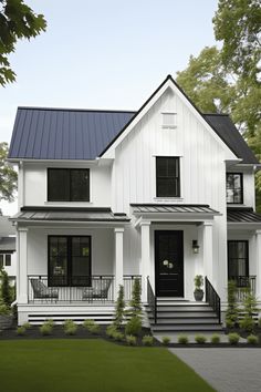 a white house with black shutters on the front porch and steps leading up to it