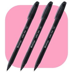 three pens sitting next to each other on a pink background