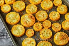 some food that is on a pan and ready to be cooked in the oven,