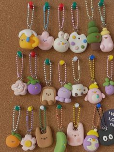 many different types of key chains hanging on a wall