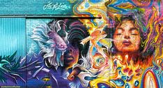 a woman is painted on the side of a building with many colors and shapes in her hair