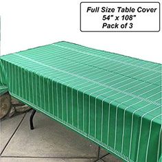 a green table cover sitting on top of a sidewalk