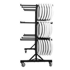 a rack that has plates on it and four black racks with white plates in them