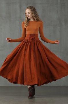 Showing again how to reinvent classic silhouettes, Linennaive crafts this full skirt with a lace-up waistband for a contemporary appeal.In a burnt orange and dark chocolate shade, the skirt is cut for a flared fit and sits high at the waist for an elongating silhouette. Promoting equality with classic and uniform piece Maxi Linen Skirt, Skirt Winter, Retro Skirt, Linen Fashion, My Fair Lady, Fair Lady, Dyed Linen, Winter Skirt, Party Skirt