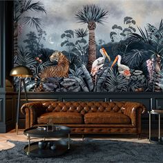 a living room filled with lots of furniture and wallpaper covered in tropical animals on it