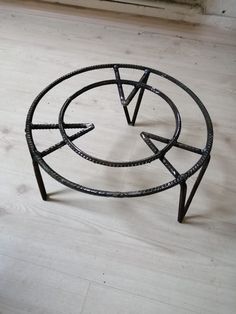 a metal object sitting on top of a wooden floor