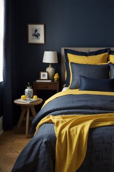 a bedroom with blue walls and yellow bedding in the corner, along with a small side table