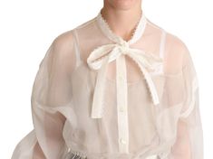 DOLCE & GABBANA Gorgeous brand new with tags, 100% Authentic Dolce & Gabbana white blouse is complemented by an ascot collar. The fitted model with long sleeves is made of fine silk jersey. Model: Ascot Collar Long Sleeve Top blouse shirt Material: 90% Silk 10% Cotton Color: White Logo details Made in Italy Dolce E Gabbana, White Silk, Guess Jeans, White Blouse, Dolce & Gabbana, Jean Coat, Sweater Shirt, Shirt Blouses, Christian Louboutin