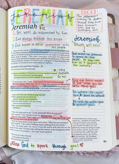 an open bible with colorful writing on the pages and some other things in it,