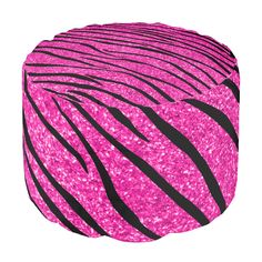 a pink and black zebra print poufce