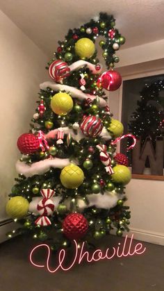 a christmas tree decorated with candy canes and ornaments