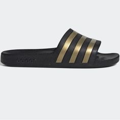 Adidas Adilette Aqua Slides Brand New In Box - Never Worn Core Black / Gold Metallic / Core Black Adidas Smooth Slip-Ons Reveal Their Adidas Dna With Signature 3-Stripes. Soft Cushioning Rewards Tired Feet With Plush Comfort. Regular Fit Slip-On Construction One-Piece Molded Eva Upper Eva Outsole Soft Cloudfoam Footbed Lightweight Feel; Quick-Drying Material Imported Product Color: Core Black / Gold Metallic / Core Black Product Code: Eg1758 Adidas Dna, Adidas Slippers, Color Core, Ronaldo Videos, Adidas Adilette, Black Adidas, Slip Ons, Adidas Shoes, Adidas Women