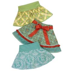 three skirts with different patterns and colors, all labeled in the same font on each side