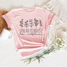 Kindness Shirt, Inspirational Shirt, Kind Shirt, Be Kind Shirt, Flower Shirt, Spread Kindness Shirt, Motivational Shirt, Shirts For Women How to Order?  1-Choose your t-shirt color, 2- Choose your size, 3- Select the quantity, 4- Click Add to Cart.  Production and shipping: * 100% airlume combed and ring-spun cotton, 32 singles 4.2 oz. * Solid colors are %100 cotton * Heathers are %52 cotton %48 polyester * Athletic Heather is combed and ring-spun cotton, 10% polyester * Seamless collar * Heat t Pink Short Sleeve Shirt With Plant Print, Pink Cotton Tops With Plant Print, Pink Cotton T-shirt With Plant Print, Pink Crew Neck Shirt With Floral Print, Pink Floral Print Crew Neck Shirt, Pink Floral Print Shirt With Crew Neck, Be Kind Shirt, Kindness Shirt, Spread Kindness