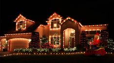 a house with christmas lights on it and the words light up the season written below