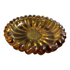 a golden glass bowl on a white background