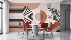 a modern dining room with red chairs and a round table in front of an abstract wall mural