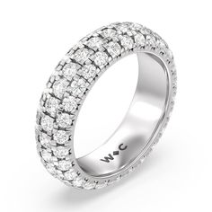 a white gold ring with rows of diamonds