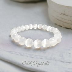 -Experience the powerful energy of Selenite with our handmade Selenite Bracelet Natural Stones 8mm High Grade Unisex Healing Bracelet. Crafted with precision from high-grade natural stones, this unique bracelet features 8mm Selenite beads, known for their distinct healing properties. Choose between 6.5 - 8.5 inches  -Selenite is believed to promote mental clarity, inner peace and provide protection from negative energy. Each bead is carefully selected to ensure the highest quality and purity of Selenite Bracelet, Powerful Energy, Power Crystals, Unique Bracelets, Healing Bracelets, Nature Bracelets, Crystal Bracelet, Bracelet For Women, Crystal Bracelets