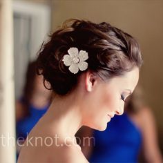 a woman with a flower in her hair