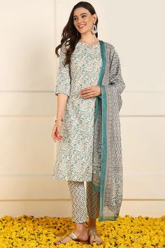 Grab this beautiful 3-piece set. The set comes with floral print straight shape kurta has round neck, 3/4th sleeves & calf length teamed with printed trouser pant with side pocket and a printed dupatta to match. Color - Teal Blue Kurta Fabric-Cotton Pant Fabric-Cotton Dupatta Fabric - Cotton Neck-V Neck Sleeves-3/4th Sleeves Work -Floral Print Detailing Washing Instructions-Dry Clean DISCLAIMER - The color of the product may be differ due to screen settings of device. A misprint here and a color drop slip there is the beauty of printing which is not treated as a defect. Spring Straight Kurta Sets With Printed Motifs, Floral Print Straight Kurta Pant Set For Eid, Spring Block Print Straight Kurta Set, Cotton Floral Print Straight Kurta Pant Set, Floral Cotton Straight Kurta Pant Set, Cotton Pant Set With Floral Print And Straight Kurta, Floral Print Cotton Pant Set With Straight Kurta, Spring Pant Set With Straight Kurta And Printed Motifs, Spring Pant Set With Printed Motifs And Straight Kurta