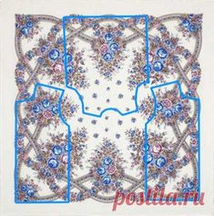 a blue and white square scarf with flowers on the bottom, in an ornate pattern