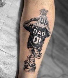 a man's arm with a tattoo on it that says dad on the front