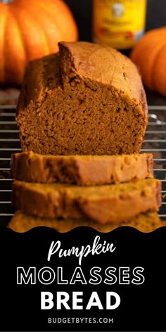 pumpkin molassses bread on a cooling rack with oranges in the background and text overlay that reads pumpkin molassses bread