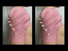 the back of a woman's pink dress with pearls on it