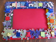 a colorful puzzle frame sitting on top of a wooden table