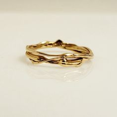 Handmade one-of-a-kind wedding band or stackable 14k yellow gold ring from the Lava Collection. The photos are taken of the exact same ring from different angles. The matching diamond engagement ring shown on the hand, can be purchased separately from the following link: https://www.etsy.com/ca/listing/1511066748/diamond-one-of-a-kind-ring-organic-ring DETAILS:  - Solid 14k yellow gold  - Ring size 8 - SKU: EK40104 -*The diamond engagement ring is not included. CUSTOM ORDER:  A ring similar to t Organic Rings Engagement, Molten Gold, Handmade Wedding Rings, Bespoke Rings, Organic Rings, Organic Ring, Stackable Ring, Handmade Wedding, Stackable Rings