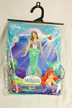 the little mermaid doll is in its plastic bag and it's attached to a hook